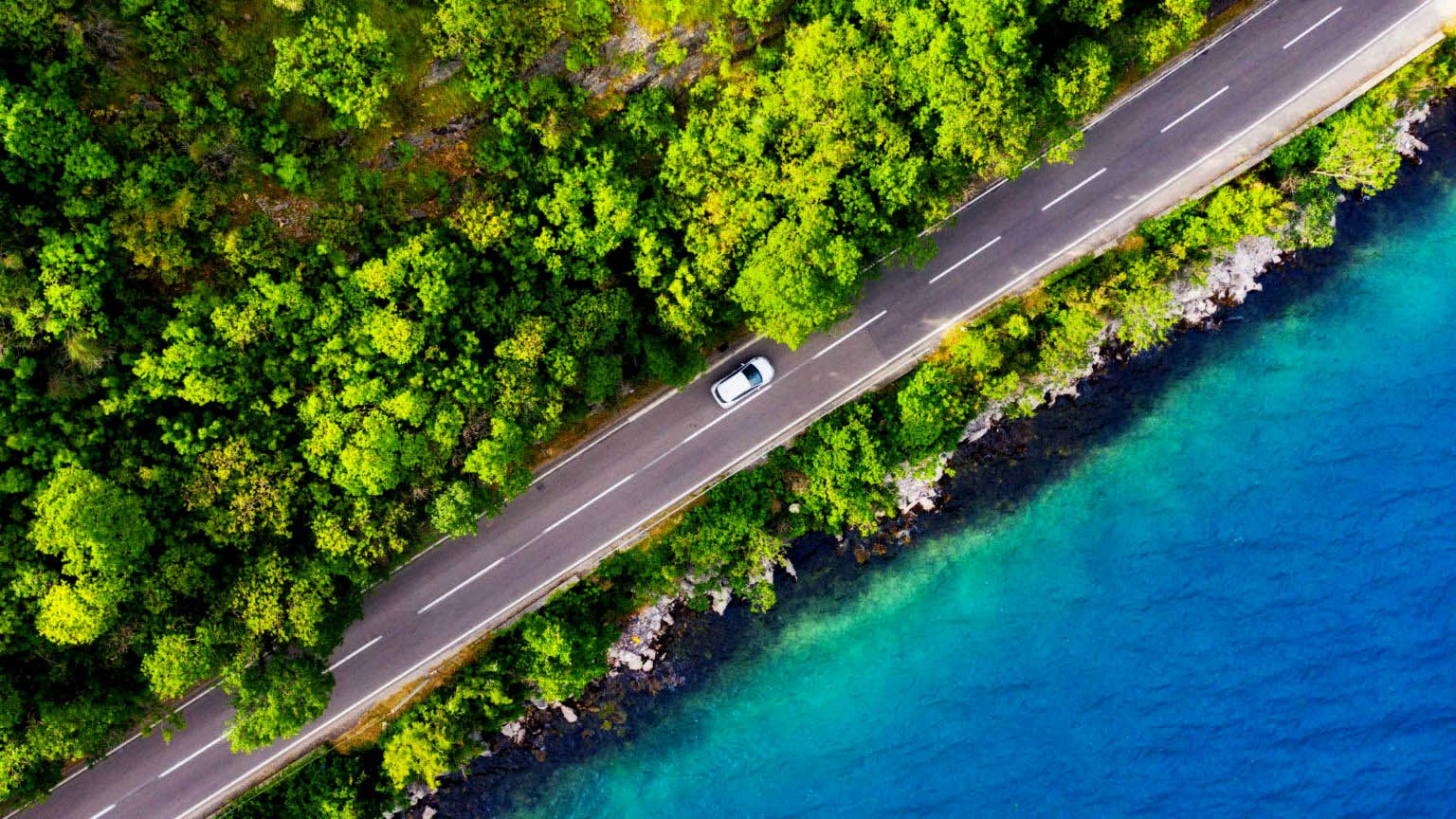 car driving by water
