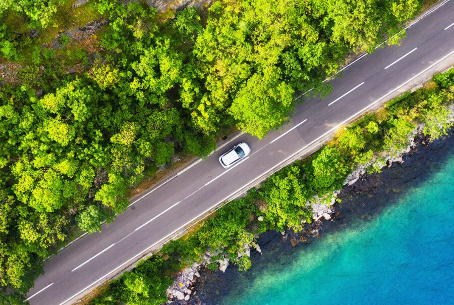 car driving by water
