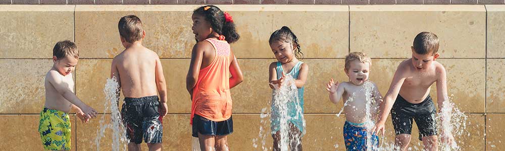Kids playing in a fountain