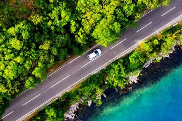 Car driving by water
