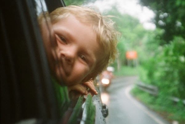 Child with head out of window