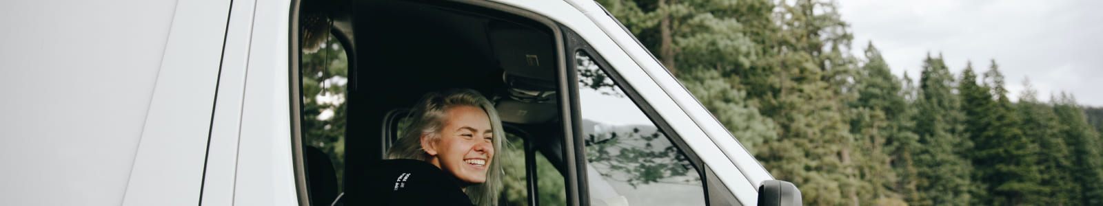 Lady smiling in van